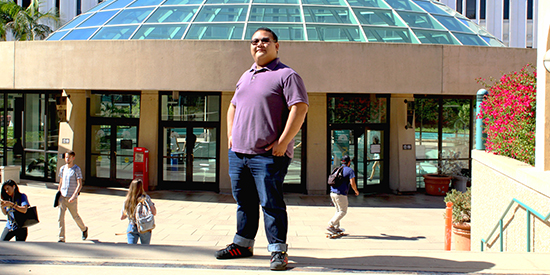 Adrian Diaz of Digital humanities in front of Love Library