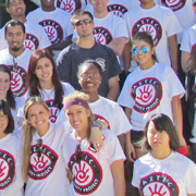 students pose in matching t-shirts