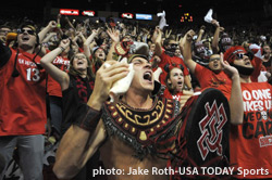 The Aztec Warrior leads a cheer at a basketball game