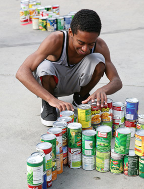 photo: student working on the can-struction