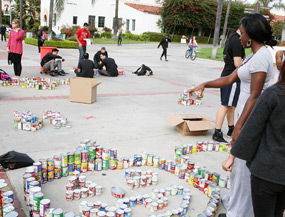 photo: student directs can-struction arrangement