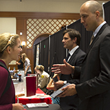 student talking with prospective employer