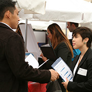 two people talking at career services fair