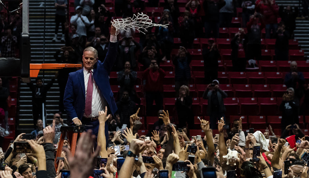 Aztecs Basketball coach cutting the net