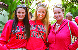 2 female students with their mom at Family Weekend