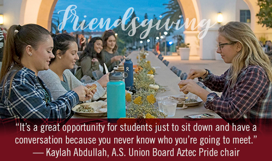 students gathering at friendsgiving dinner