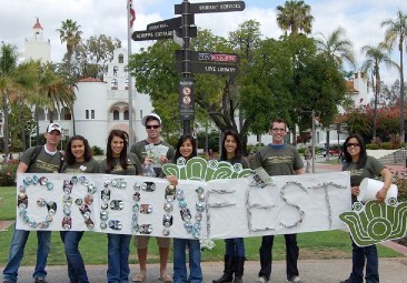 Students pose with Greenfest sign