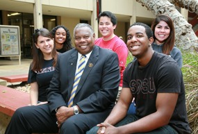 Dr. Kitchen poses with students