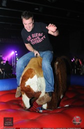 Student riding mechanical bull Aztec Nights 2012