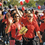 parade participants wave to the crowd