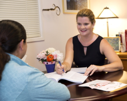 ombudsman director speaking with female