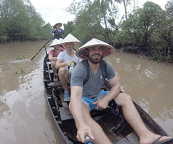 study abroad student on river boat