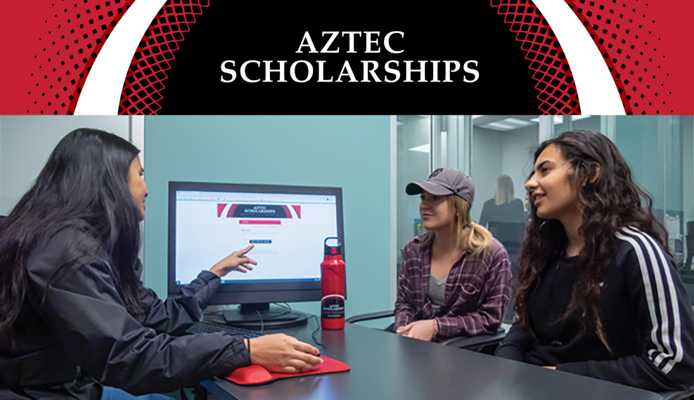 Female staff member showing two female students how to log into Aztec Scholarships